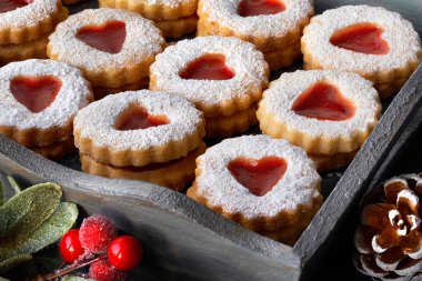 Close-up on a tray of traditional Christmas Linzer cookies