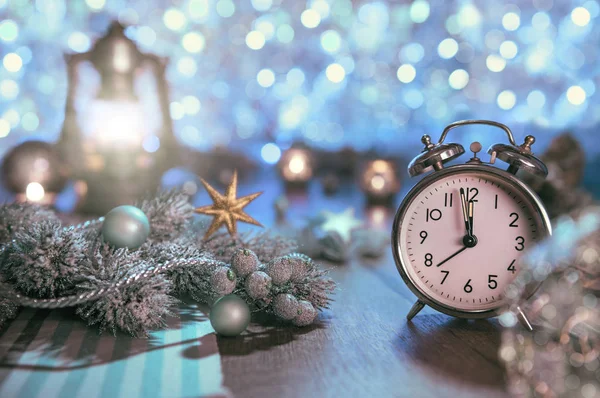 Alarm clock and glittering decorations — Stock Photo, Image