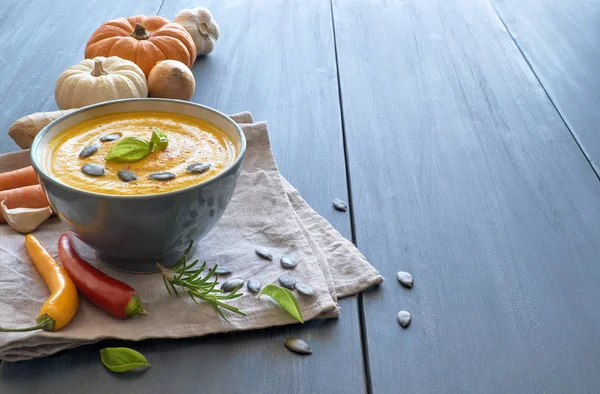 Pumpkin, carrot and ginger creme soup in ceramic bowl — Stock Photo, Image