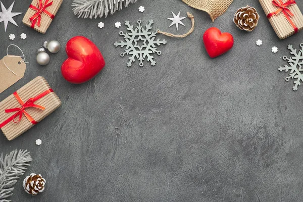 Christmas background with red stone hearts, wrapped gifts, tags, — Stock Photo, Image