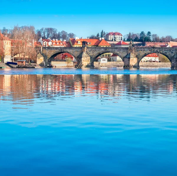 Prague, Charles bridge reflected in Vltava river — Stock Photo, Image