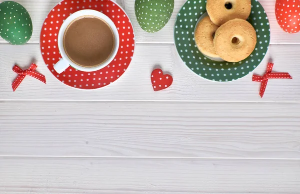 Top view on light wooden table with a cup of coffee, cookies and — Stock Photo, Image