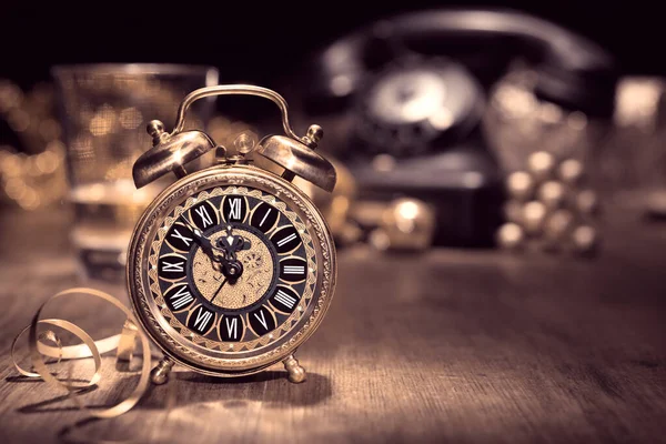 Vintage alarm clock showing five to twelve — Stock Photo, Image