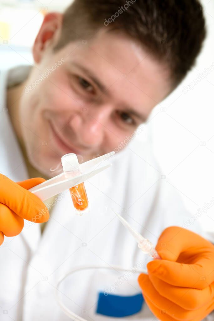 Young scientist with cryosample