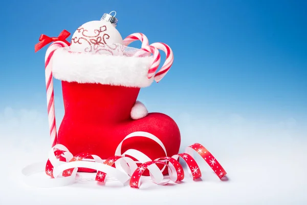 Santa's boot with candy canes, text space — Stock Photo, Image