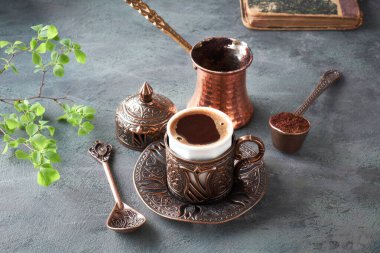 Oriental coffee cooked in traditional Turkish copper coffee pot  clipart