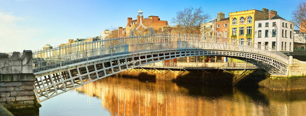 Dublin, panoramic image of Half penny bridge, or Ha'penny bridge, on a bright day