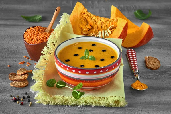 Spicy pumpkin soup with red lentils and turmeric served with min — Stock Image Spicy pumpkin soup with red lentils and turmeric served with min Stock Photo