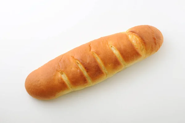 Dlouhý Máselový Chléb Izolovaný Bílém Pozadí — Stock fotografie