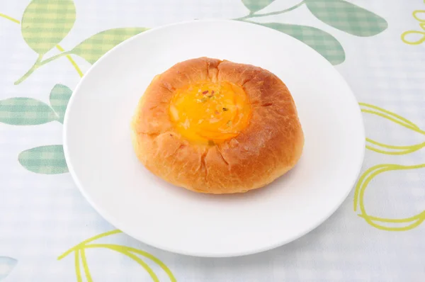 Orange marmalade bread on plate on table cloth — Stock Photo, Image