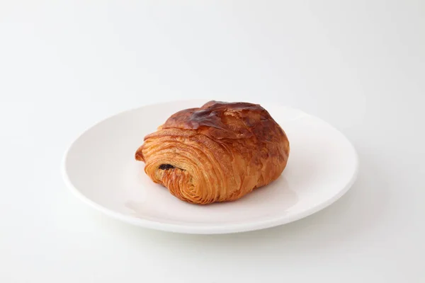 French bread pain au chocolat chocolate croissant on plate on white background — Stock Photo, Image