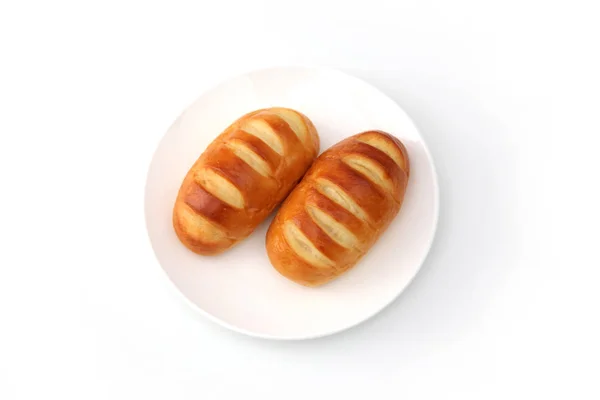 Mantequilla pan rollo en plato aislado sobre fondo blanco —  Fotos de Stock