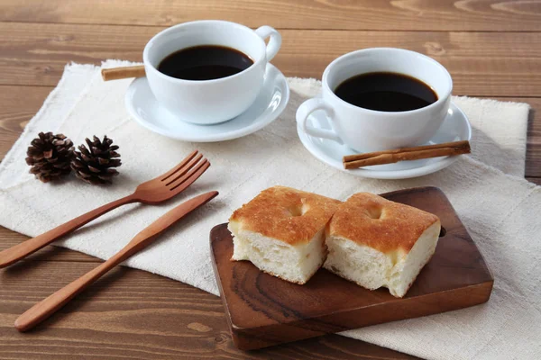 Focaccia pizza bread on wooden table with cup of coffee — Stock Photo, Image