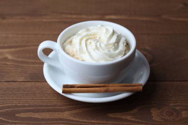 viennese coffee with whipped cream on wooden table