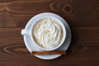 viennese coffee with whipped cream on wooden table