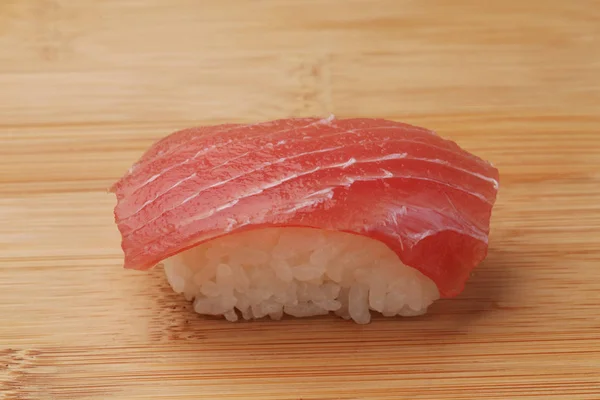 Sushi of tuna isolated on cutting board — Stock Photo, Image