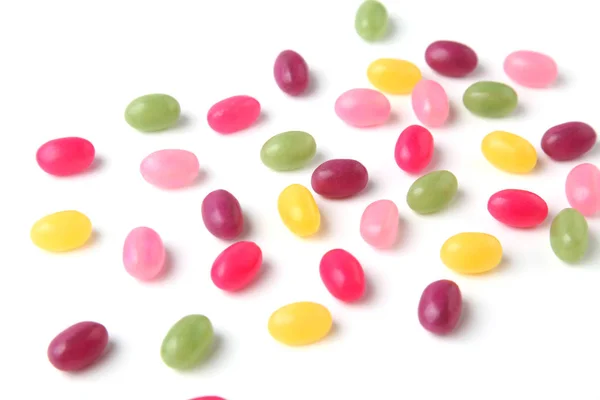 colorful candies jelly beans spread on white background