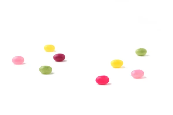 Kleurrijke Snoepjes Jelly Bonen Verspreid Witte Achtergrond — Stockfoto