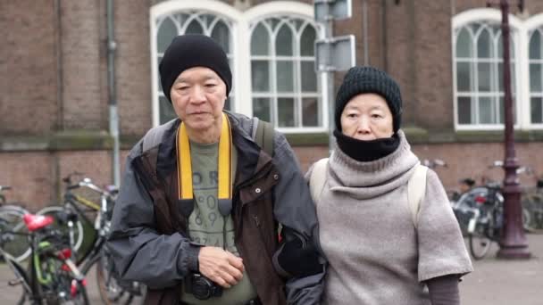 Asian Senior Elder Couple Travel Europe Back Pack Slow Motion — Stock Video