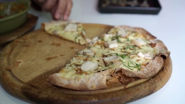 Hand Taking Thin Crust Homemade Chicken Herb Pizza — Stock Video