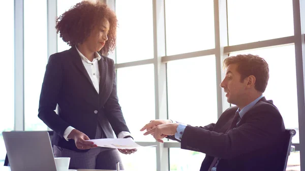 Caucasian man in trouble having problem with his female boss