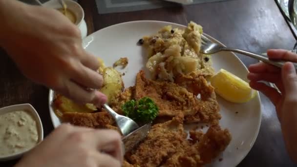 Eating Pork Schnitzel Austria Cuisine Battered Meat Sauerkraut Potatoes — Stock Video