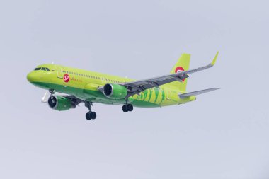 Novosibirsk, Russia - March 10, 2018: Airbus A320-214 VP-BOG S7 Airlines approaches for landing at the international airport Tolmachevo. clipart