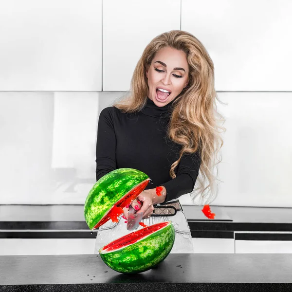 Beautiful woman cutting watermelon. Happy young woman in colored dress holding slice of a watermelon isolated over white background. Beautiful model woman cutting fresh fruit organic vegan lifestyle.