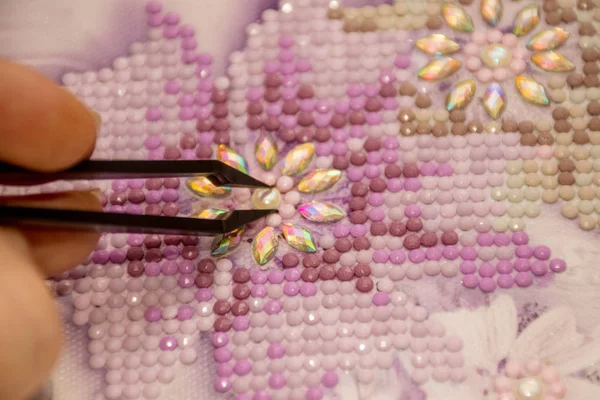 Diamond painting embroidery craft. Acrylic rhinestones. Closeup, selective focus — Stock Photo, Image