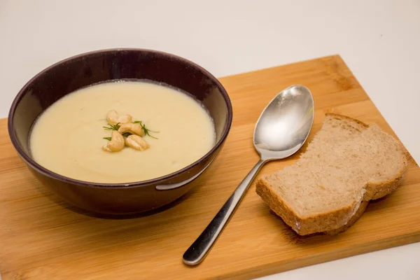Delicious vegan cream soup with leek, potatoes, garlic and cashew nuts. Dairy free and gluten free.