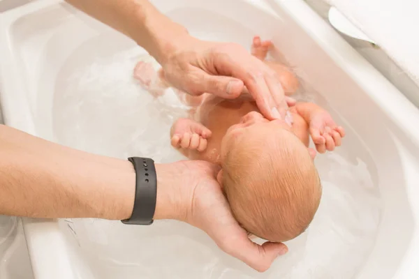 Father Hands Holding Bathing Newborn Baby White Baby Bath First — Stock Photo, Image