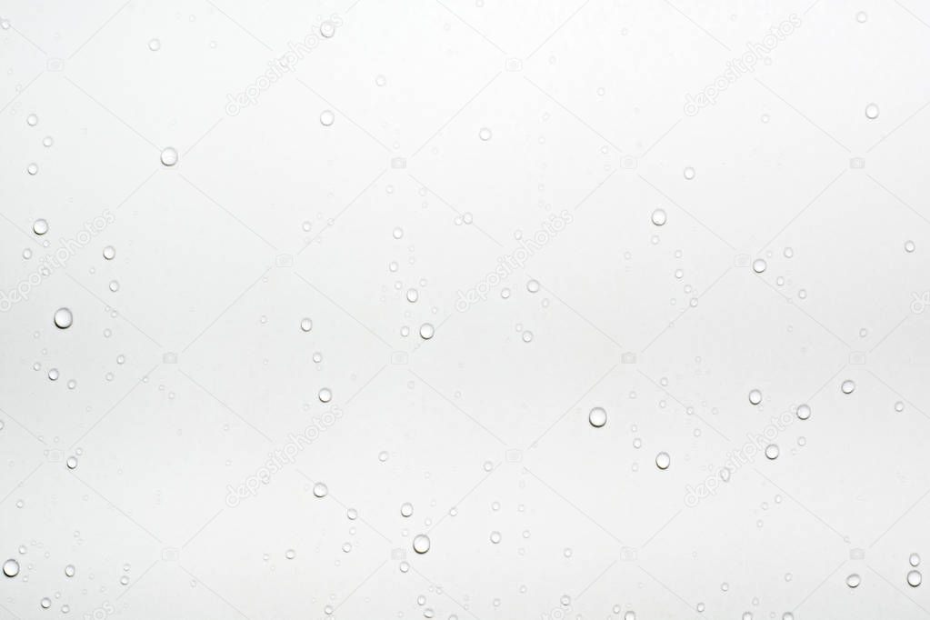 Water drops on white surface background.