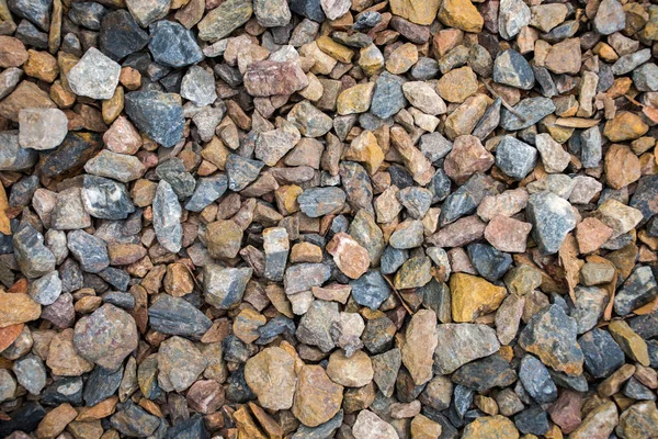 Top view of blue and brown construction gravel texture background. Stock Image