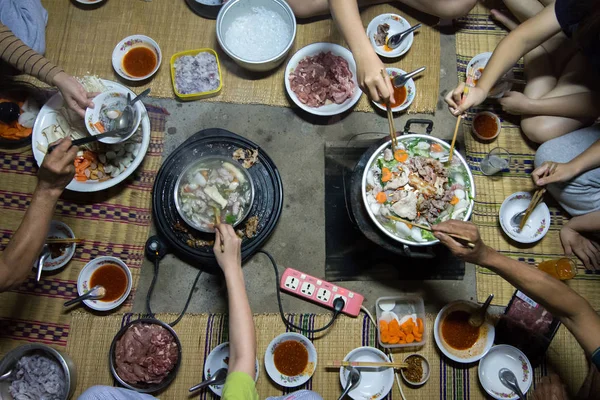 Top view of family enjoy eating Shabu and Brabecue together.