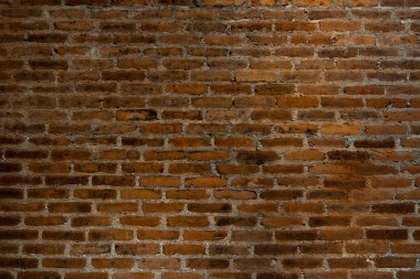 Kırmızı kahverengi tuğla duvar koyu doku arka plan.