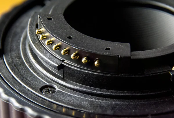 Close up of camera lens mount and lens contacts.