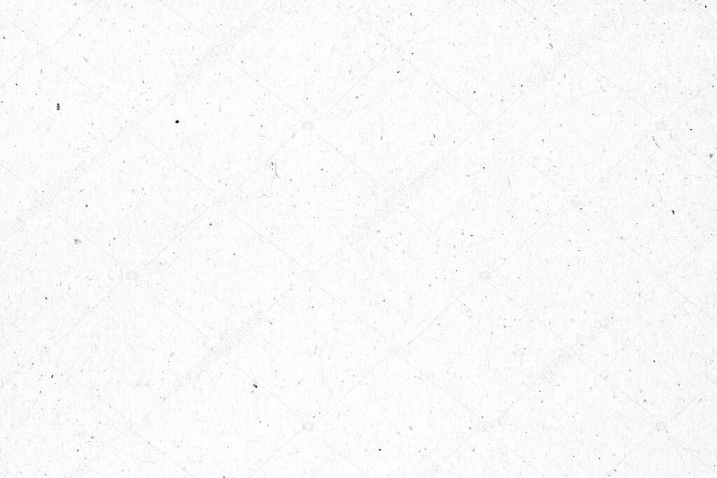 White paper or cardboard texture with black spot background.