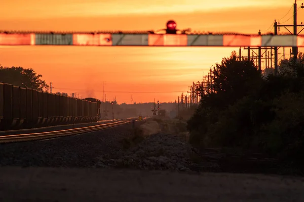 Rail Road crossing and tracks at sunset — Stock Photo, Image