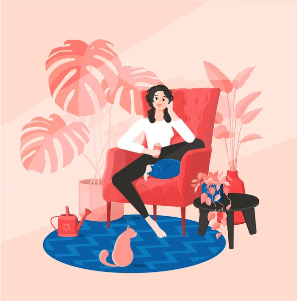 パジャマ姿の少女は猫と椅子に座っている フラット漫画スタイルでカラフルなベクトルイラスト サラウンドホーム植物 マンステラ 散水缶 テーブルとカーペット — ストックベクタ