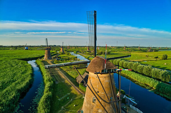 Aerial view of traditional windmills in Kinderdijk, The Netherlands. This system of 19 windmills was built around 1740 and is a UNESCO heritage site.