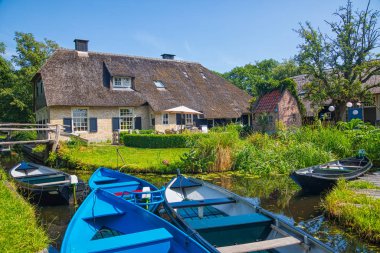 Giethoorn, Netherlands - July 4, 2018: view of famous village Giethoorn with canals in the Netherlands. Giethoorn is also called 'Venice of The Netherlands' 