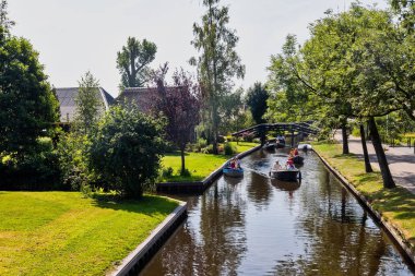 Giethoorn, Netherlands - July 4, 2018: view of famous village Giethoorn with canals in the Netherlands. Giethoorn is also called 'Venice of The Netherlands' 