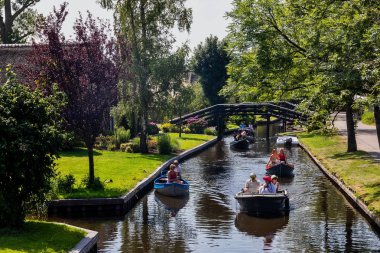 Giethoorn, Netherlands - July 4, 2018: view of famous village Giethoorn with canals in the Netherlands. Giethoorn is also called 'Venice of The Netherlands' 