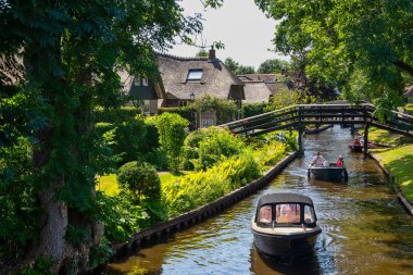Giethoorn, Netherlands - July 4, 2018: view of famous village Giethoorn with canals in the Netherlands. Giethoorn is also called 'Venice of The Netherlands' 