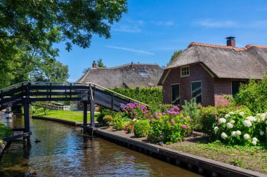 Giethoorn, Netherlands - July 4, 2018: view of famous village Giethoorn with canals in the Netherlands. Giethoorn is also called 'Venice of The Netherlands' 