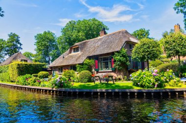 Giethoorn, Netherlands - July 4, 2018: view of famous village Giethoorn with canals in the Netherlands. Giethoorn is also called 'Venice of The Netherlands' 