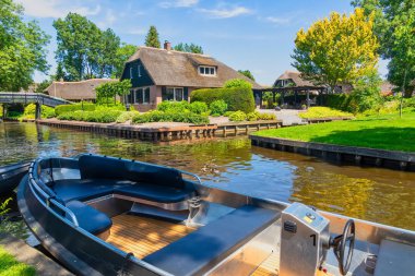 Giethoorn, Netherlands - July 4, 2018: view of famous village Giethoorn with canals in the Netherlands. Giethoorn is also called 'Venice of The Netherlands' 