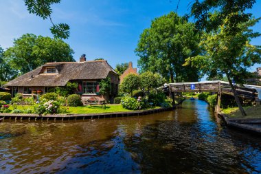 Giethoorn, Netherlands - July 4, 2018: view of famous village Giethoorn with canals in the Netherlands. Giethoorn is also called 'Venice of The Netherlands' 