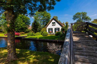 Giethoorn, Netherlands - July 4, 2018: view of famous village Giethoorn with canals in the Netherlands. Giethoorn is also called 'Venice of The Netherlands' 