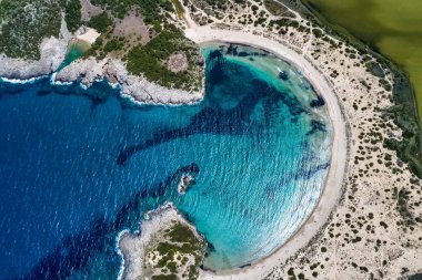 Panoramic aerial view of voidokilia beach, one of the best beaches in mediterranean Europe, beautiful lagoon of Voidokilia from a high point of view, Messinia, Greece clipart